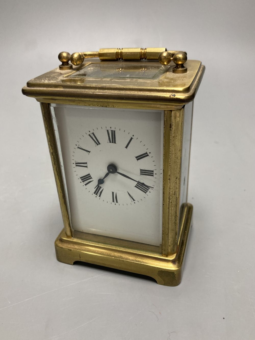 A gilt-brass carriage timepiece, with white enamelled Roman dial and outer travelling case and another carriage clock (2)